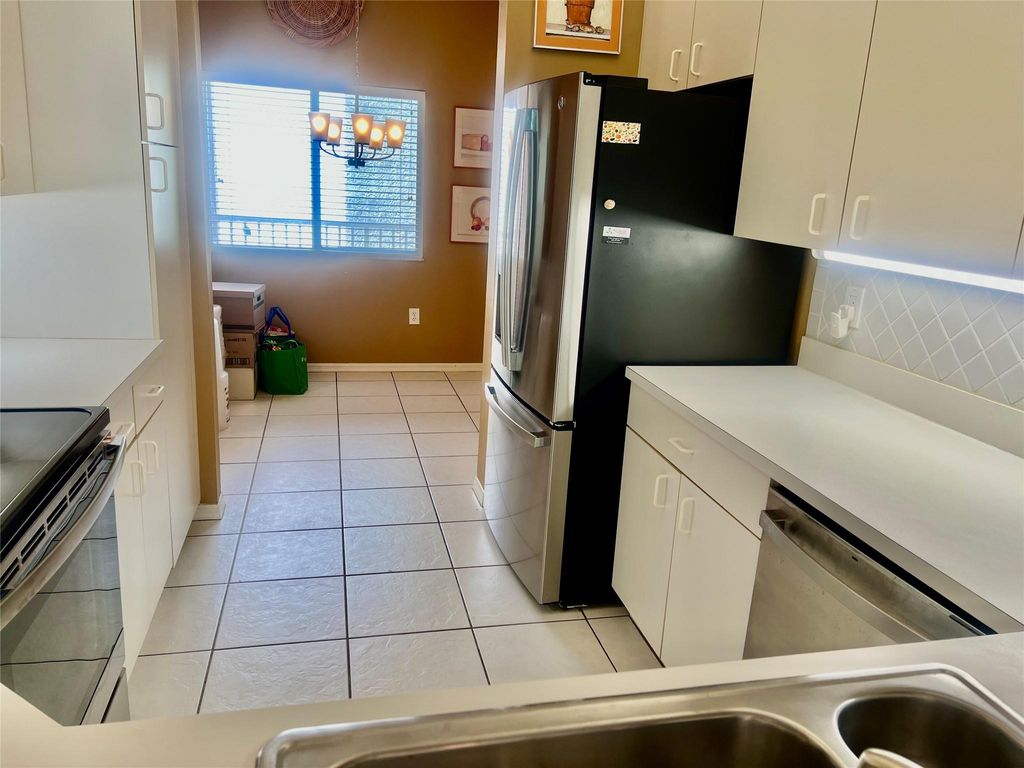 Photo of 9539 Weldon Cir #F406, Tamarac, FL 33321 (MLS # F10512913)