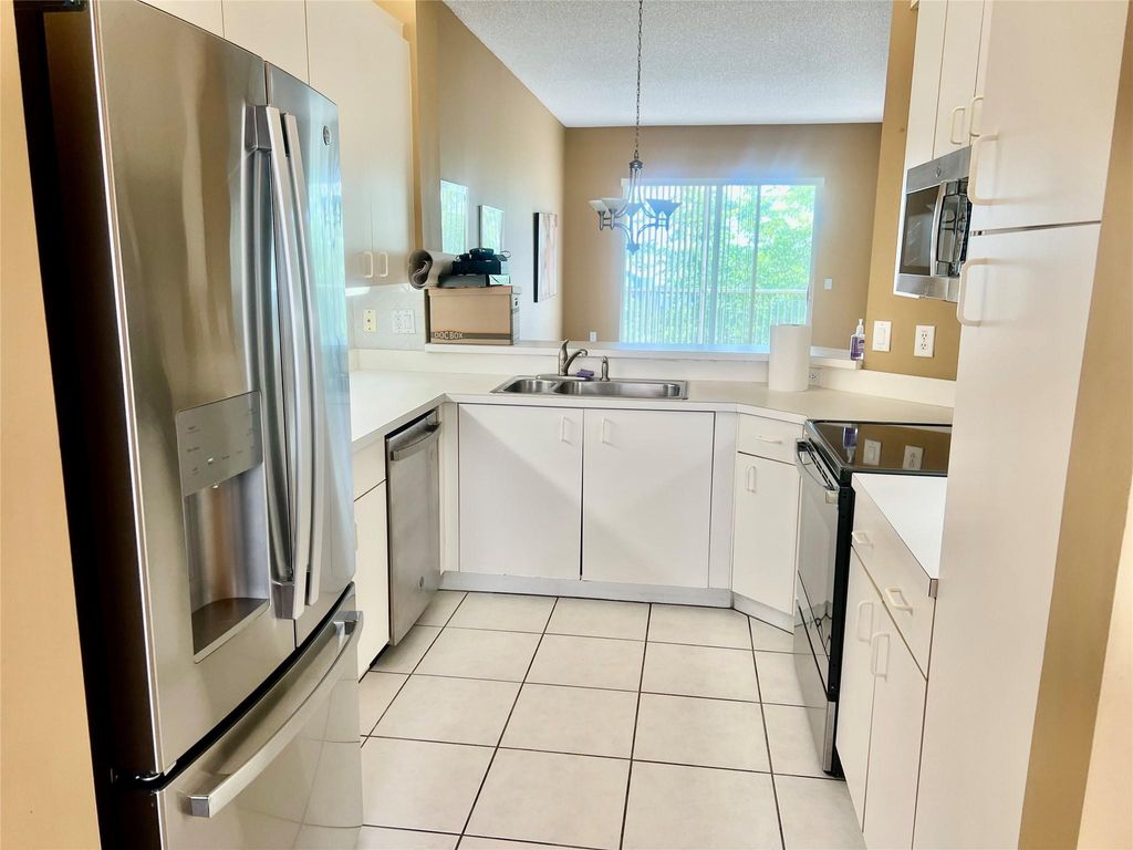 Photo of 9539 Weldon Cir #F406, Tamarac, FL 33321 (MLS # F10512913)