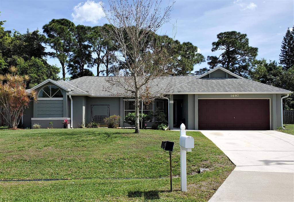 A Lovely CBS Pool Home has 3 Bedrooms 2 Baths, 2 Car Garage, Huge Screened Pool Area 41' x 34' on over a 1/3rd of Acre. This Home Features Whole House Backup Generator System, Pool Solar Heat System, New Hot Water Heater, Pool Enclosure was Completely Rescreened, New Exterior Paint, Pool Deck has New Anti-Slip Coating, the Covered Patio has been Remodeled New Wood Ceiling, New LED Ceiling Fans, Patio has Granite Grip Floor Covering, and Hurricane Shutters. You'll enjoy hours of entertaining as you relax in the Pool Paradise with its Privacy Fencing. A Remodeled Master Bath, with its Granite & Mahogany Vanity, Dual Sinks; the Shower has a Full-Size Built-In Bench, Accent Tiling. New Carpet in All the Bedrooms, Large Pocket Sliding Patio Doors Brings the Outside In. Inside Laundry Room