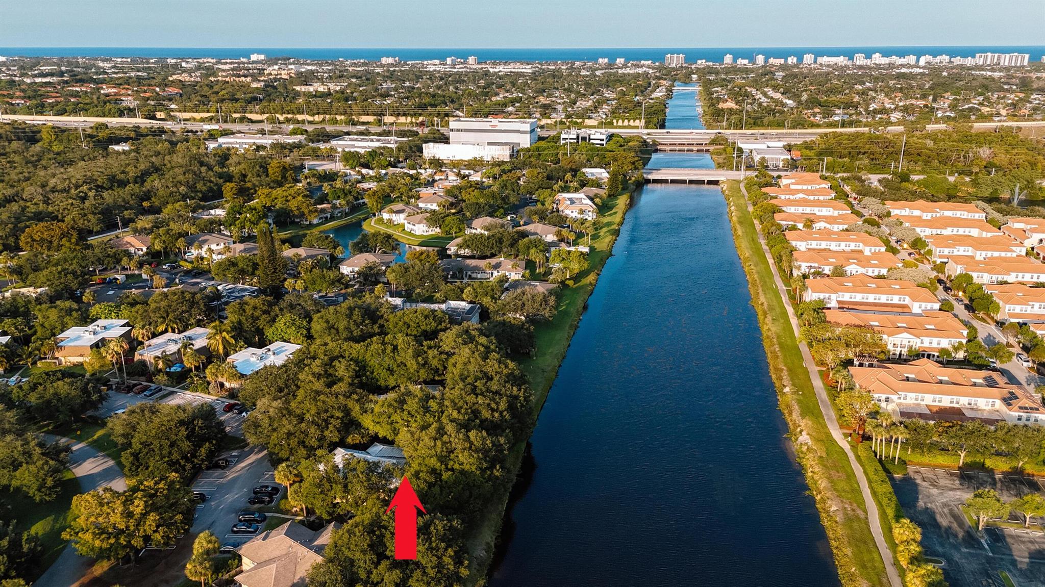Beautiful Townhome with fantastic view from each room of very wide canal and garden. Laminate flooring. In a very desirable community of Delray Oaks. Just one mile to I-95 at Congress Exit. Quite, shaded hidden gem. Patio is large with a great view of the canal. Community with great amenities, pool, tennis, picnic area, lake, club house, walking, fish in your back yard.Come and see this unit. Assigned parking #141 next to mail box and entry way.