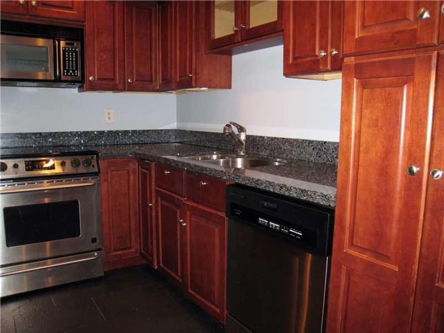 Rio Vista townhouse. Two bedroom 2.5 bath plus huge formal dining room.  Modern kitchen with stainless, granite and cherry wood. Super large living room with wood burning fireplace and french doors to private patio and garden. Really big master bedroom wi th french doors opening to private wood deck balcony. First floor has wood floors throughout. Giant swimming pool. Large dogs welcome. Minutes to downtown, the airport, the beaches and I 95. Quiet street.