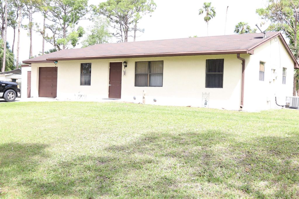 Photo of 13573 41st Lane N, The Acreage, FL 33411 (MLS # R11079192)