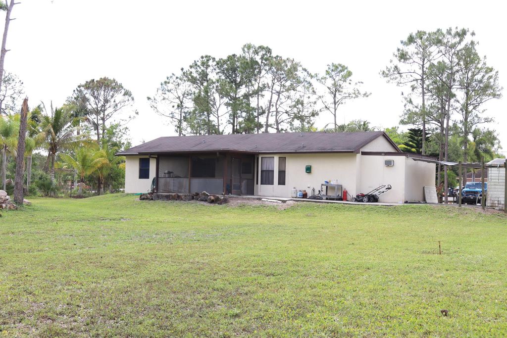 Photo of 13573 41st Lane N, The Acreage, FL 33411 (MLS # R11079192)