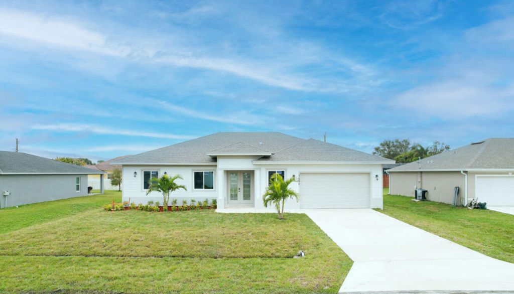 Photo of 1434 SW Oriole Lane, Port Saint Lucie, FL 34953 (MLS # R11049337)