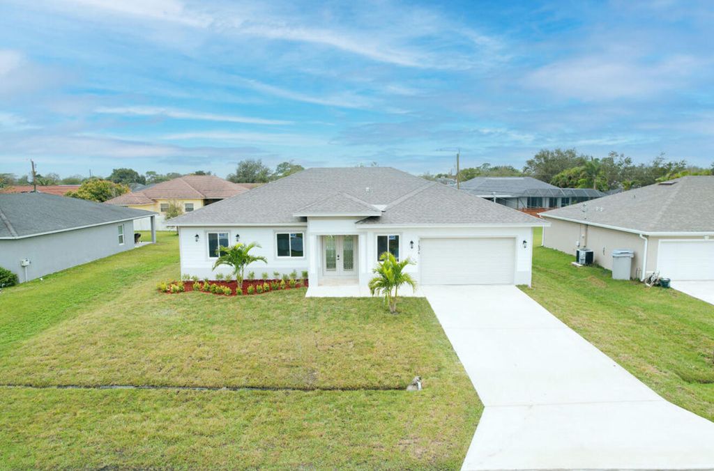 Photo of 1434 SW Oriole Lane, Port Saint Lucie, FL 34953 (MLS # R11049337)