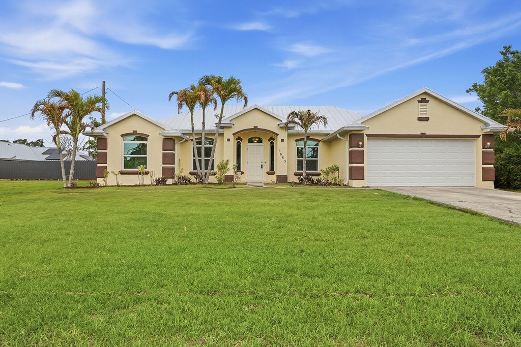 Photo of 1685 SW Starman Avenue, Port Saint Lucie, FL 34953 (MLS # B26015018)