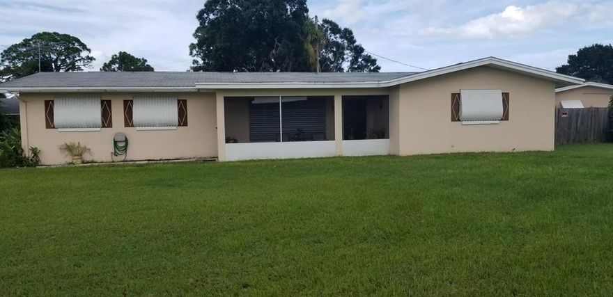 Bonus room and a Florida room.  Beautiful original terrazzo floors.   Spacious covered porch it is also screened in.  Lots of closets and lots of space.  Property sits on a corner.  Easy access to US1 and interstate. Bedrooms are very spacious. Located on a corner lot.  Come see it wont last!!! WASHER and DRYER does not convey.