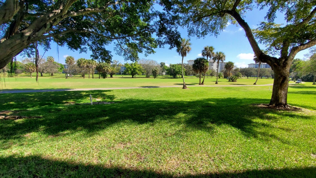 Photo of 3800 Oaks Clubhouse Drive #112, Pompano Beach, FL 33069 (MLS # B26050266)