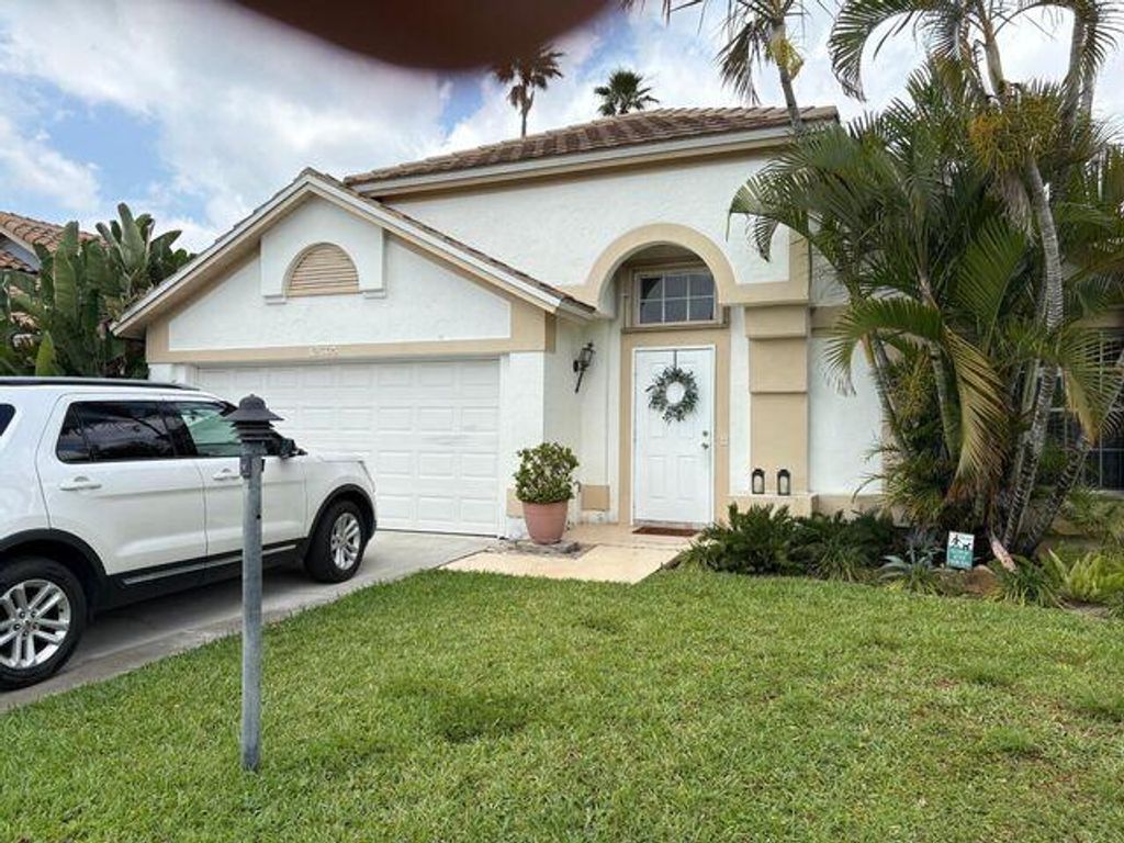 Photo of 12665 Coral Breeze Drive, Wellington, FL 33414 (MLS # B26030013)