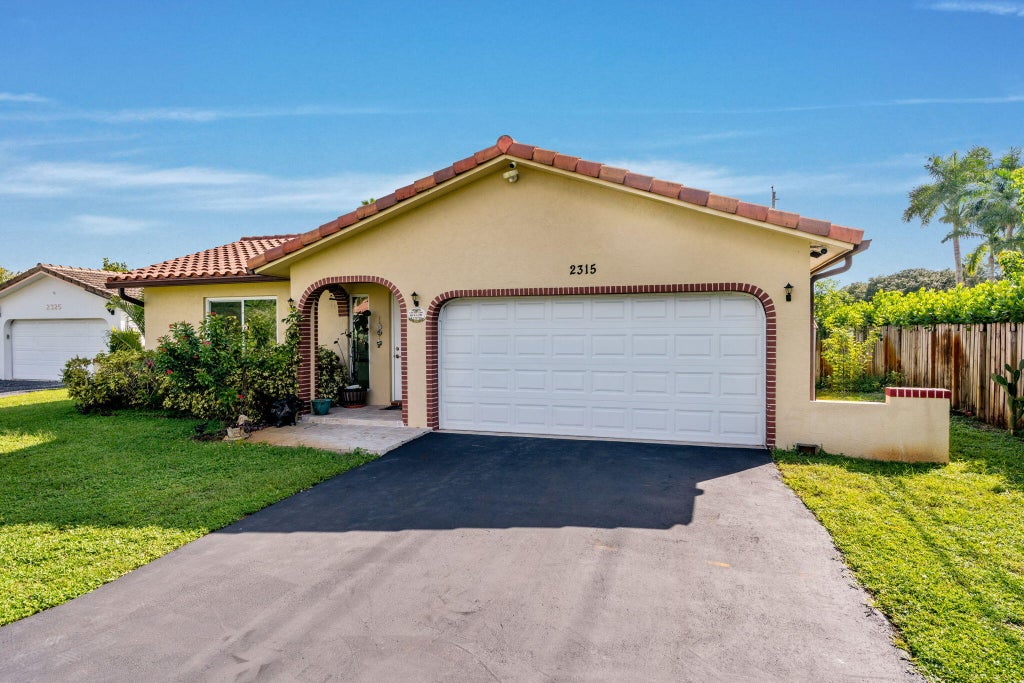 Photo of 2315 NW 98th Lane, Coral Springs, FL 33065 (MLS # B26088950)