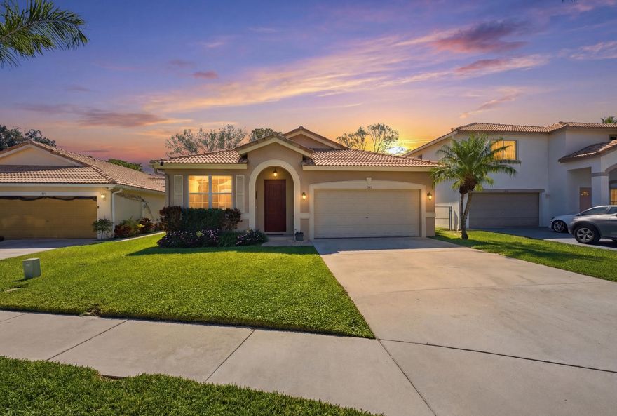 From the moment you arrive you'll appreciate the quiet charm of this gated Boynton Beach community, centrally located just minutes to I-95, shopping, dining, and beaches. Inside, new flooring flows throughout, complemented by a 2023 A/C and 2021 water heater. The garage features built-in organization and a generator for added peace of mind during hurricane season. Wired surround sound enhances everyday living, while the spacious primary suite offers a large walk-in closet. Unwind on the screened porch overlooking a peaceful canal and beautifully landscaped backyard.