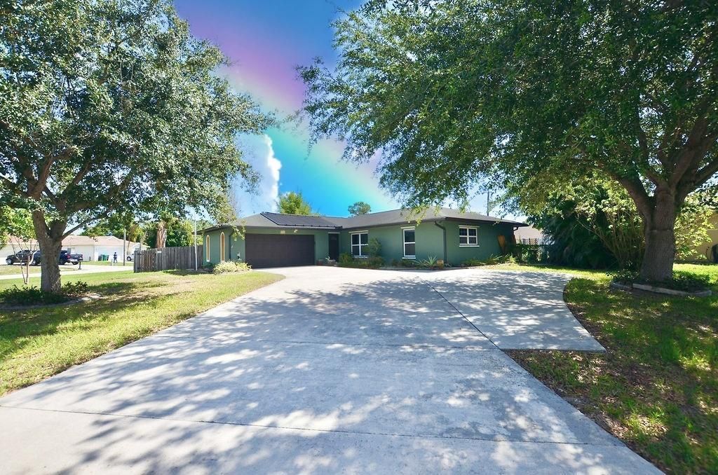 Photo of 1101 SE Puritan Lane, Port Saint Lucie, FL 34983 (MLS # R10722895)