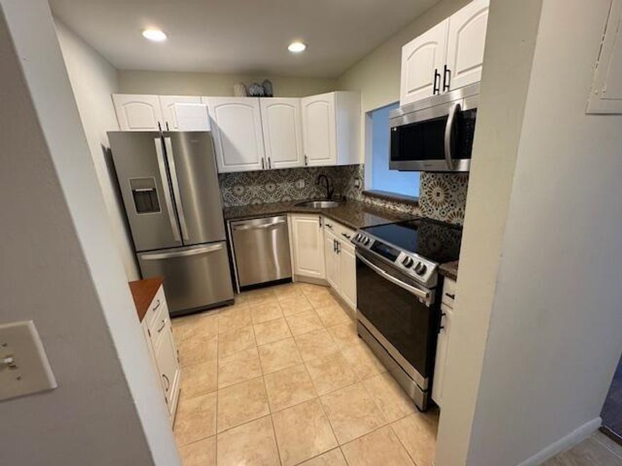 Beautiful and bright one bedroom one and one half bathroom condo on the second floor.Upgraded bathrooms and kitchen with newer appliances.Clean and ready to move in. Easy drive to shopping, Turnpike and airport. Building has an elevator with laundry and trash disposal on each floor. Must See.One owner must be 55 or over.