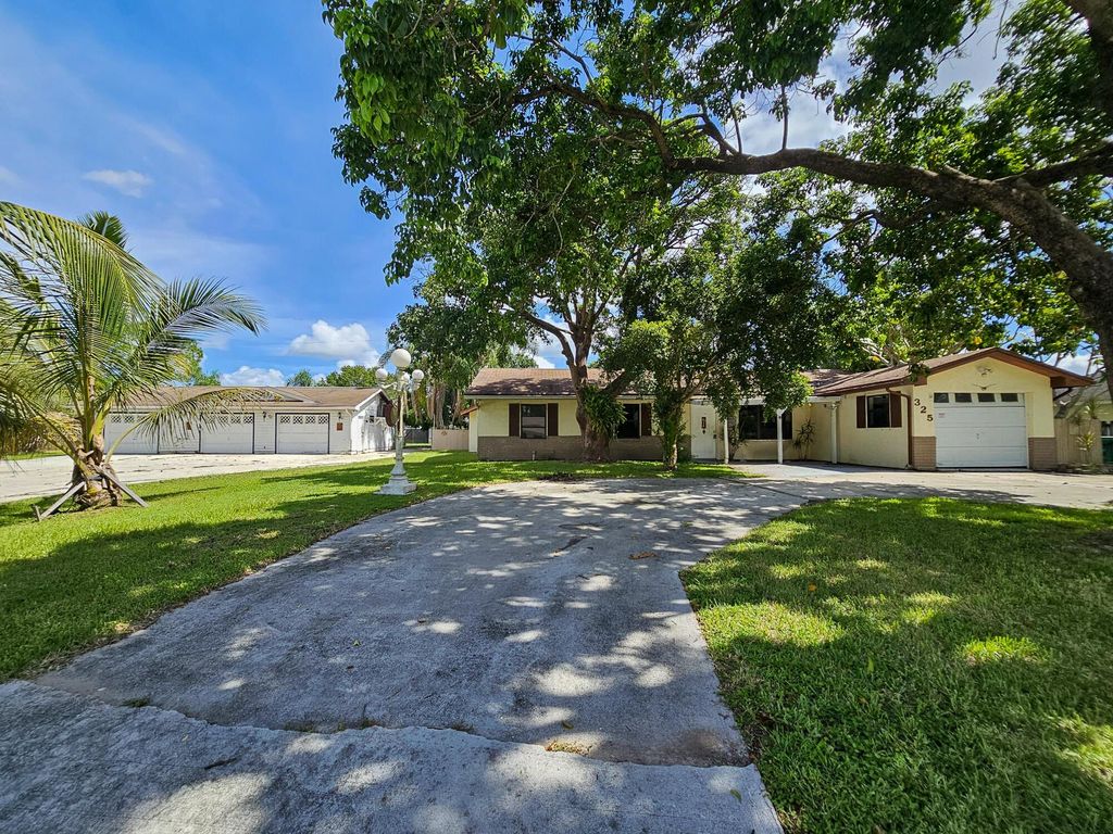 Photo of 325 NW Rebecca Avenue, Port Saint Lucie, FL 34983 (MLS # R11116327)