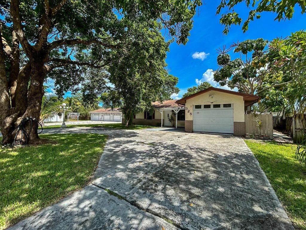 Photo of 325 NW Rebecca Avenue, Port Saint Lucie, FL 34983 (MLS # R11116327)