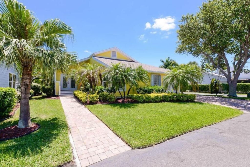 Photo of 4031 NE Breakwater Drive, Jensen Beach, FL 34957 (MLS # R11120485)