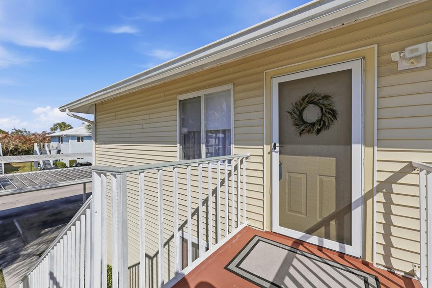 Welcome to this beautifully maintained 3-bedroom, 2-bath corner condo in The Fountains of St. Lucie! Located on the second floor, this light and bright unit offers 1,116 living sq ft with an open-concept layout and vaulted ceilings that create a spacious feel throughout. The updated kitchen features modern cabinetry, stainless steel appliances, and a breakfast bar that flows seamlessly into the oversized 21x21 living and dining area — perfect for entertaining. Ceramic tile flooring runs throughout the main living spaces for easy maintenance. Additional features include inside laundry, detached covered carport, metal roof, and low monthly HOA fees that include cable, exterior maintenance, roof, insurance, lawn care, pool service, clubhouse, spa, and more. Conveniently located east of US-1 near shopping, dining, beaches, and medical facilities.