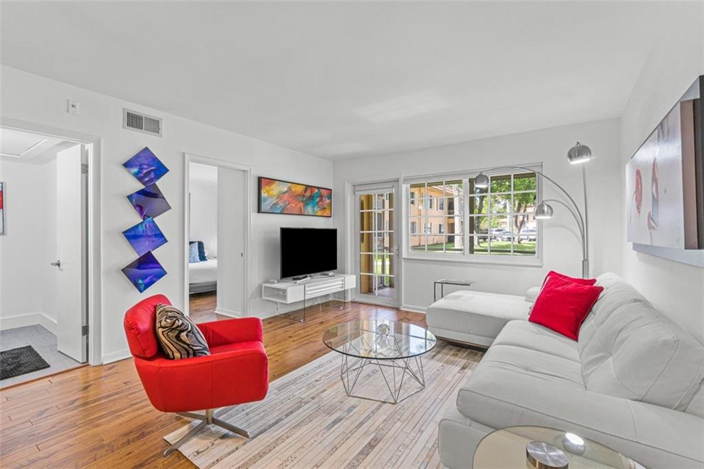 Stunningly renovated, beautifully furnished and modern ground floor unit in the sought-after Manor Grove Village Phase 4. Corner unit with a screened patio overlooking the courtyard that is light, bright and totally redone to perfection with newer kitchen, new baths, ensuite laundry, all impact windows/doors, and the finest of finishes. If you want the "WOW" factor, then you have found it with this 1 BR/1.5 BA turnkey furnished property! Spotless, modern & a perfect "10" that is just minutes from Wilton Drive! Newly renovated interior access hallways. Newly renovated Club House facility with Pool, Sauna, Showers, Billiards, Party Room, and Kitchen. Tennis courts are exclusive to Manor Grove IV.
