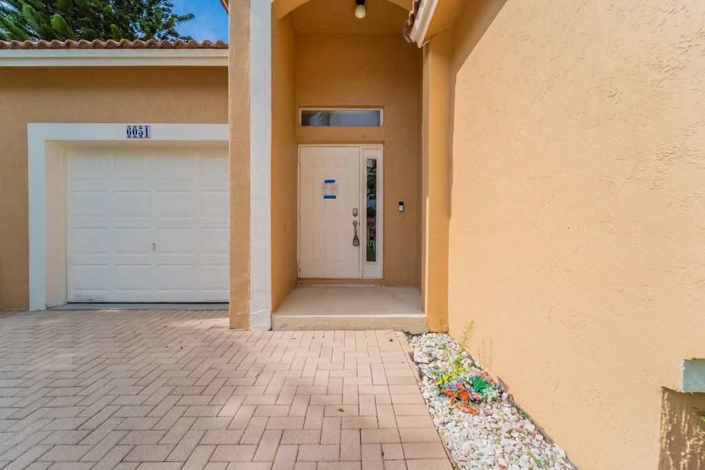Photo of 6051 NW 41st Drive, Coral Springs, FL 33067 (MLS # F10511070)