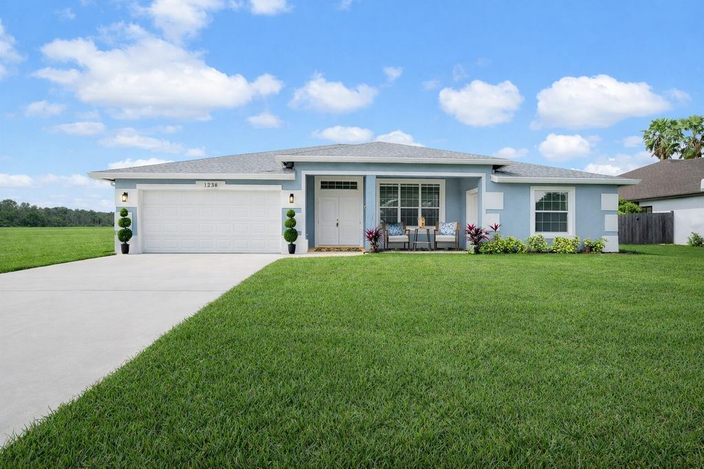 Photo of 1238 SW Milan Lane, Port Saint Lucie, FL 34953 (MLS # B26000006)