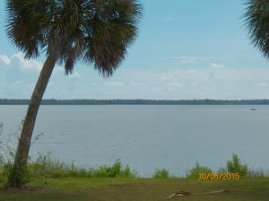 Enjoy the Spectacular and expansive view of the Indian River while sitting on your front porch or looking out from your bedroom, kitchen or living area. This 3/2 Concrete block, Key West - looking home has a garage and has been completely remodeled - nothing was spared. It sits on a little more than  1/2 acre with riparian rights. Step inside to appreciate the crown molding,  wood cabinets in kitchen also with granite, plantation shutters and beautiful wood floors throughout. All new electric,  plumbing, septic, well, water softener, Air conditioner,  metal roof, and high impact windows and irrigation system.   Measurements approximate.  Easy to show.  Owner realtor.