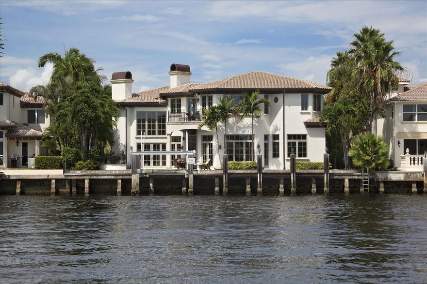 Directly on the Intracoastal Waterway, this magnificent Mediterranean estate was built by A&V Development with exceptional architectural design by John Obarowski. Impressive entrance opens to the circular motor court amid lush tropical grounds.  Affording splendid Intracoastal views, an entertainment loggia leads to a dramatic pool with cascading spa situated along 85+/- ft. of waterfrontage.