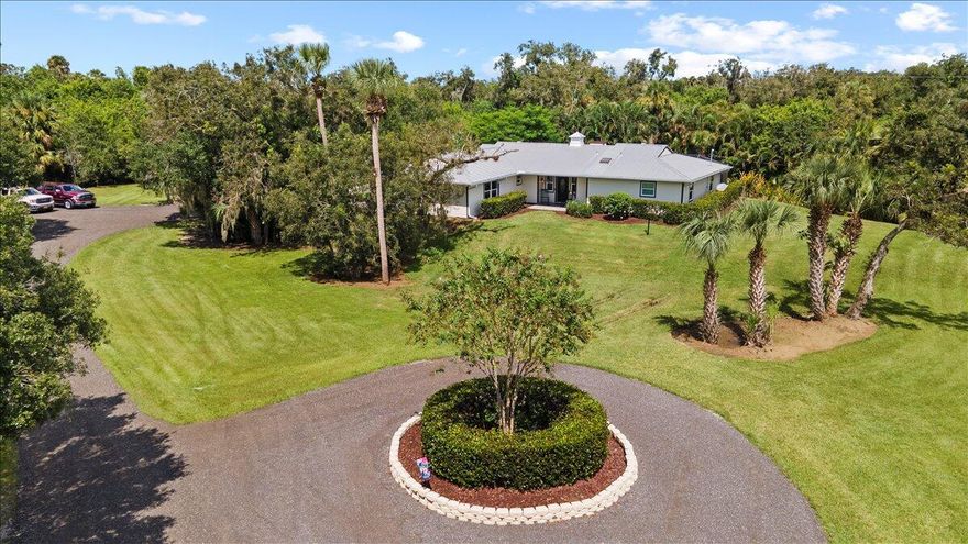Modern Farmhouse Style Ranch awaits you on a 7 Acre Country Estate only 15 minutes from town. Updated exceptional paradise located in St Lucie County. Bring your friends, family, toys, animals & enjoy a private lifestyle like no other along Ten Mile Creek. Featuring an updated well maintained charming & inviting home with Metal Roof, 4 BR's & 3 Full BA's. Foyer entrance, vaulted ceiling & grand stone wood burning fireplace. New Luxury Vinyl floors throughout & impact hurricane windows. Beautiful updated eat in kitchen w/ wood cabinets, granite counter tops & stainless steel appliances. Inviting family room  called ''The Rose Room'' perfect for relaxing & enjoy country living at it's finest! Outside Oasis boasts pool, spacious lanai, fire pit, Horse Barn w/stables & detached carport /shed.