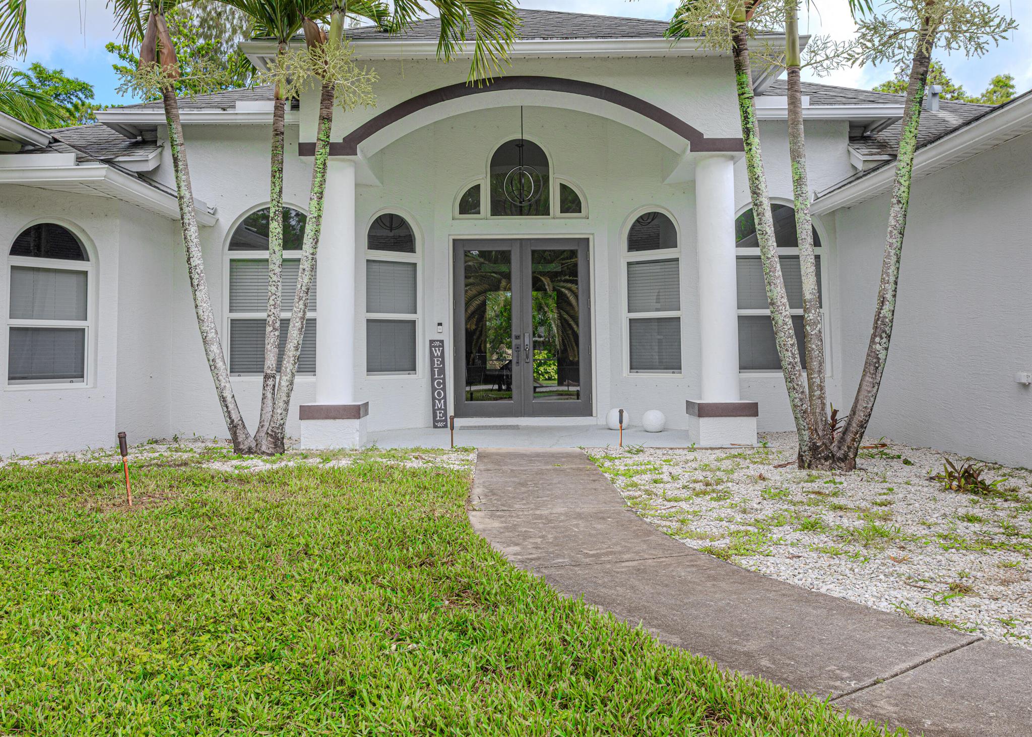 Escape to your private oasis in The Acreage! This stunning 3-bedroom, 4-bathroom estate features impact windows and doors, a newly installed pool, and a massive fully fenced yard. The spacious 3-car garage provides ample storage, while the property also includes a horse stable and plenty of room for your boat, RV, or other recreational toys. Inside, enjoy the comfort of brand new appliances and expansive living areas. With no HOA, you'll have the freedom to truly make this property your own. Country living with modern upgrades--don't miss out!