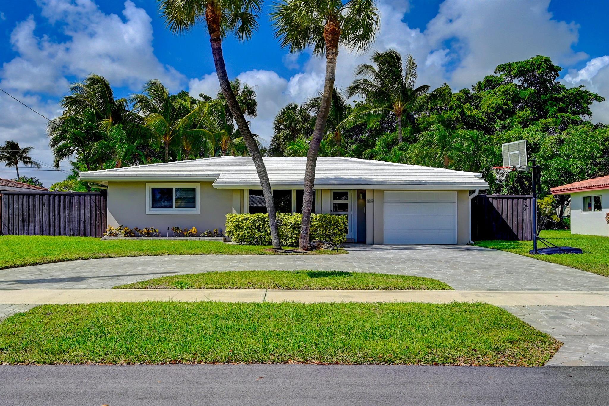 Completely renovated saltwater pool home in the desirable east Pompano Beach community of Garden Isles. Open kitchen with stainless steel appliances, marble flooring throughout, and all impact windows and doors. Private tropical backyard oasis with lush landscaping, beautiful pavers, and ample space for entertaining. Fully fenced with sprinkler system, interior laundry room, and one-car garage. Updated electrical panel. Situated on a quiet cul-de-sac with no through traffic, just minutes to beaches, restaurants, nightlife, and the newly revitalized Pompano Pier.