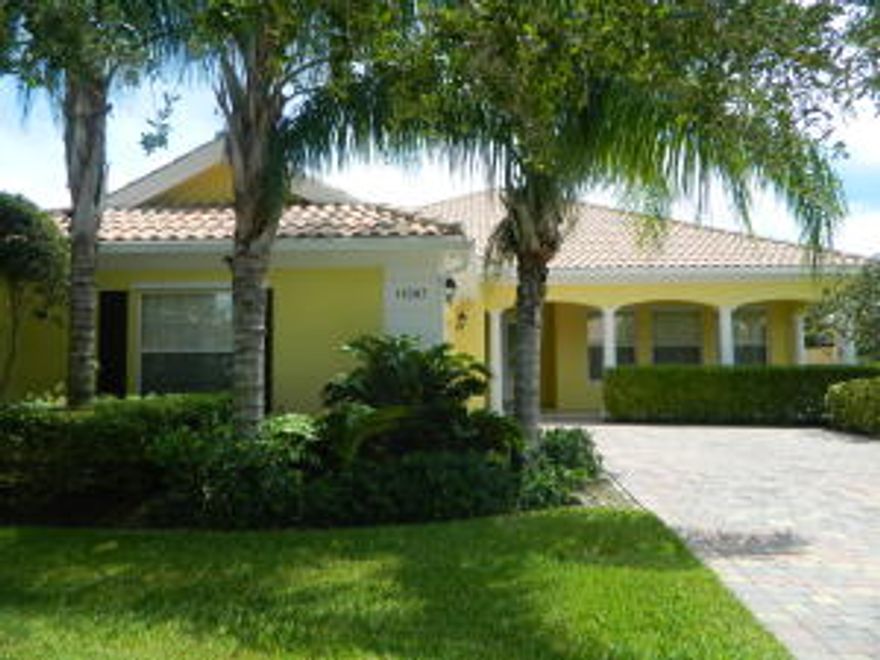 Gorgeous home with 4 bedrooms, 3 baths, living room, formal dining & family room, with a triple split floor plan. Beautiful appointed with crown molding, chair rail and wainscoting . Lots of closet space and natural light through out this Divosta built home. Covered screened patio and charming front porch. Kitchen with breakfast area, corian counter tops and stainless steel appliances. Central vacuum cleaner, inside utility room with washer and dryer and extra storage. Peaceful views of the lake . Located at the desirable Lakes at Tradition community, with 24hrs manned gated and amenities like club house, tennis, 2 heated swimming pools, fitness center, billiard & more to fit on your lifestyle .Home warranty from AHS included for the buyers.