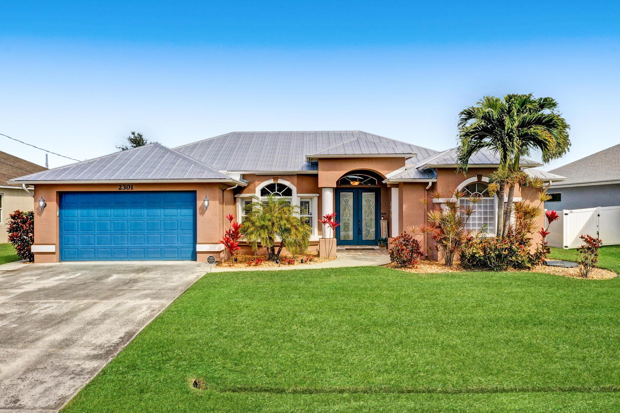 Beautifully maintained 4-BR, 3-BA Pool home on the C-24 canal offers 2,396 sq. ft. of living space! Step inside through grand double doors into an open floor plan featuring formal living & dining rooms, spacious family room, & modern kitchen with maple cabinets, granite countertops, overlooking the pool and large backyard. The oversized primary suite boasts a sitting area, two walk-in closets, & a spa-like ensuite with dual vanities, soaking tub & oversized shower. Enjoy Florida living on the 28x14 covered porch, perfect for entertaining! Take a dip in the large screened-in pool or relax on the expansive pool deck along the C-24 Canal, ideal for boating, fishing, & peaceful water views. Additional highlights include 2023 Metal Roof tile flooring, shed, RV/Boat parking, 2 car garage &