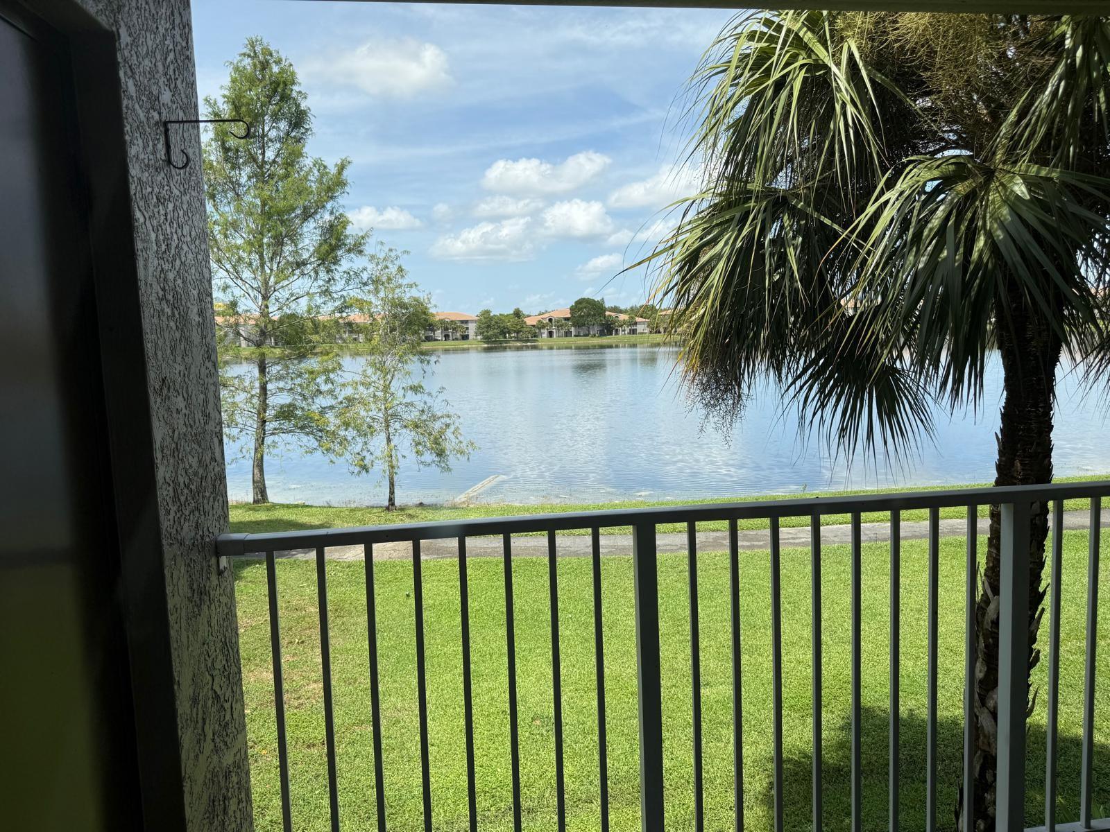 Welcome to this stunning Lakeview corner unit on the second floor—featuring soaring vaulted ceilings and a spacious 2-bed, 2-bath split floor plan. Freshly painted. With new porcelain and tile flooring throughout, a separate laundry area with full-size, newer washer/dryer, and a master bedroom with a walk-in closet, this home blends style and practicality. Every room showcases breathtaking lake views, creating a serene retreat. Located in a gated community with all amenities, it’s ideally situated near Coconut Creek schools, major highways, the Promenade, and Coconut Creek Casino. Professionally managed for hassle-free living.