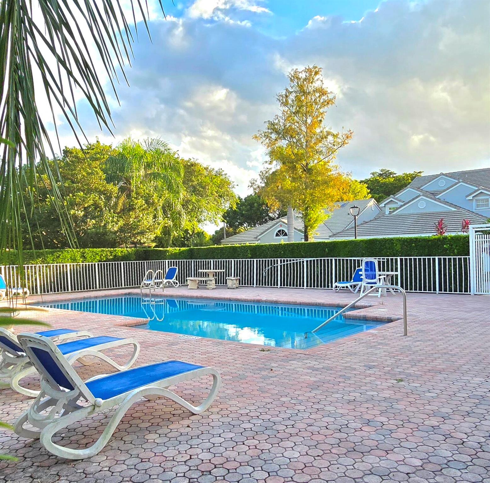 Beautiful 3-Bedroom, 2-Bath Corner Villa with 2-Car Garage in the Heart of Coral Springs! Step into this spacious & bright corner villa featuring soaring cathedral ceilings & elegant tile flooring throughout. The upgraded eat-in kitchen boasts granite countertops, a stylish extended breakfast bar & stainless steel appliances--perfect for everyday living and entertaining. Enjoy the privacy of a split-bedroom floor plan, offering a large primary suite with a walk-in closet, granite vanity & walk-in shower. The secondary bedrooms are generously sized & ideal for family, guests, or a home office. A Florida room spans the back of the home, providing extra living space. Step outside & enjoy the community pool located directly across from your front door. Comfort, convenience & great location!