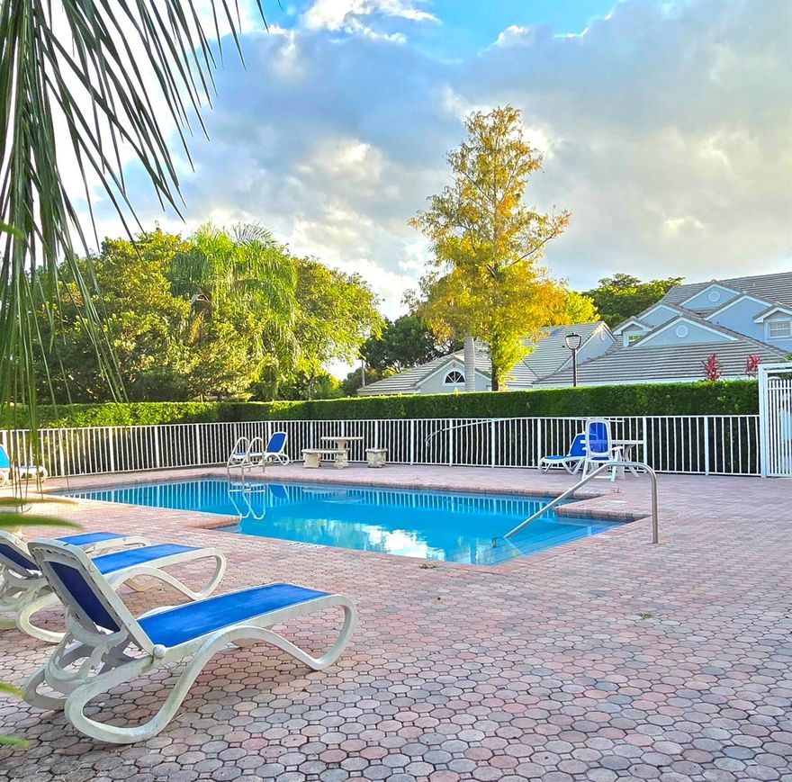 Beautiful 3-Bedroom, 2-Bath Corner Villa with 2-Car Garage in the Heart of Coral Springs! Step into this spacious & bright corner villa featuring soaring cathedral ceilings & elegant tile flooring throughout. The upgraded eat-in kitchen boasts granite countertops, a stylish extended breakfast bar & stainless steel appliances--perfect for everyday living and entertaining. Enjoy the privacy of a split-bedroom floor plan, offering a large primary suite with a walk-in closet, granite vanity & walk-in shower. The secondary bedrooms are generously sized & ideal for family, guests, or a home office. A Florida room spans the back of the home, providing extra living space. Step outside & enjoy the community pool located directly across from your front door. Comfort, convenience & great location!