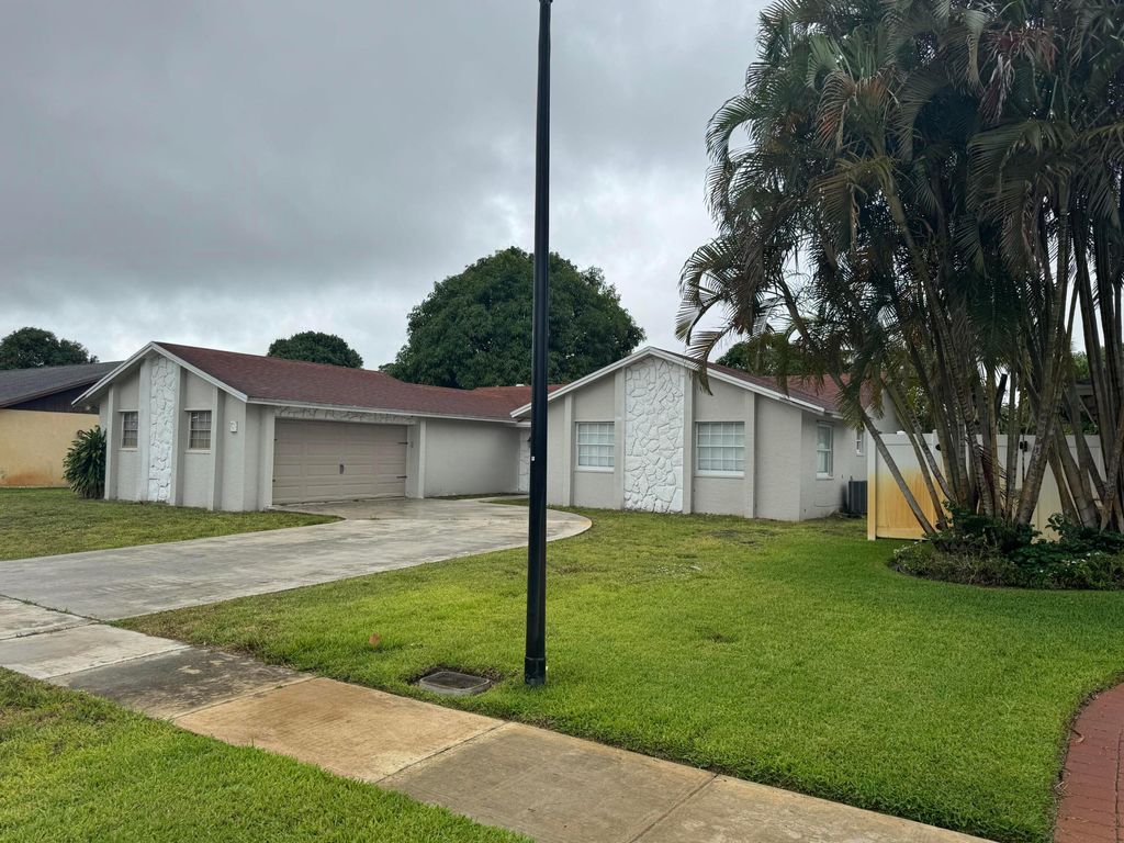 Photo of 589 Cashiers Drive, West Palm Beach, FL 33413 (MLS # B26026131)