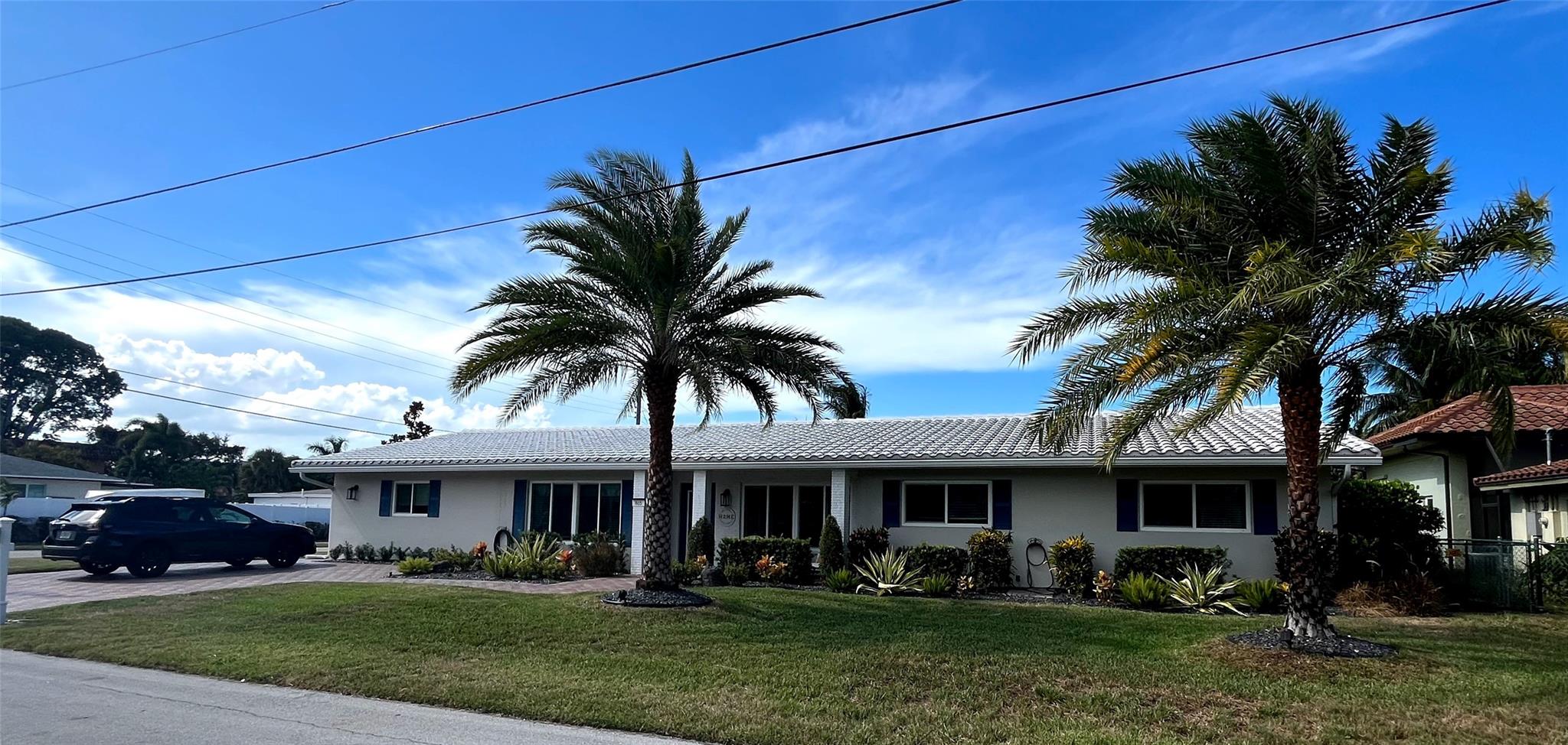 Welcome to an inviting haven nestled in East Deerfield Beach. This corner lot home offers 4 beds/3baths. Natural light floods through the impact windows/doors and the updated kitchen is a testament to both style and functionality. Owners are ready for the next exciting step of their journey, and they will take memories to last a lifetime from this sprawling ranch where they have spent many years. They love Hillsboro Heights and have enjoyed one floor living and split bedroom plan with mother-in-law suite or 2nd master suite. Beautiful pool. Enormous laundry & storage room. Gorgeous Plantation Shutters. This vibrant neighborhood is a great location, close proximity to freeways, 1 mile from the beach. shopping, dining, & entertainment Pioneer Park and boat ramp are just around the corner.