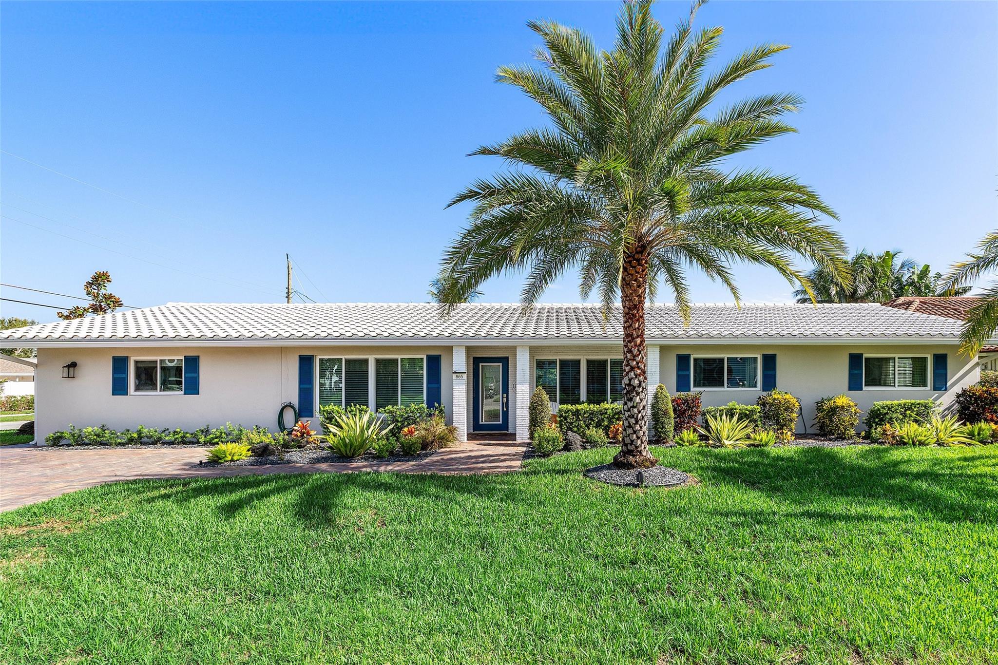 Welcome to an inviting haven nestled in East Deerfield Beach. This corner lot home offers 4 beds/3baths. Natural light floods through the impact windows/doors and the updated kitchen is a testament to both style and functionality. Owners are ready for the next exciting step of their journey, and they will take memories to last a lifetime from this sprawling ranch where they have spent many years. They love Hillsboro Heights and have enjoyed one floor living and split bedroom plan with mother-in-law suite or 2nd master suite. Beautiful pool. Enormous laundry & storage room. Gorgeous Plantation Shutters. This vibrant neighborhood is a great location, close proximity to freeways, 1 mile from the beach. shopping, dining, & entertainment Pioneer Park and boat ramp are just around the corner.