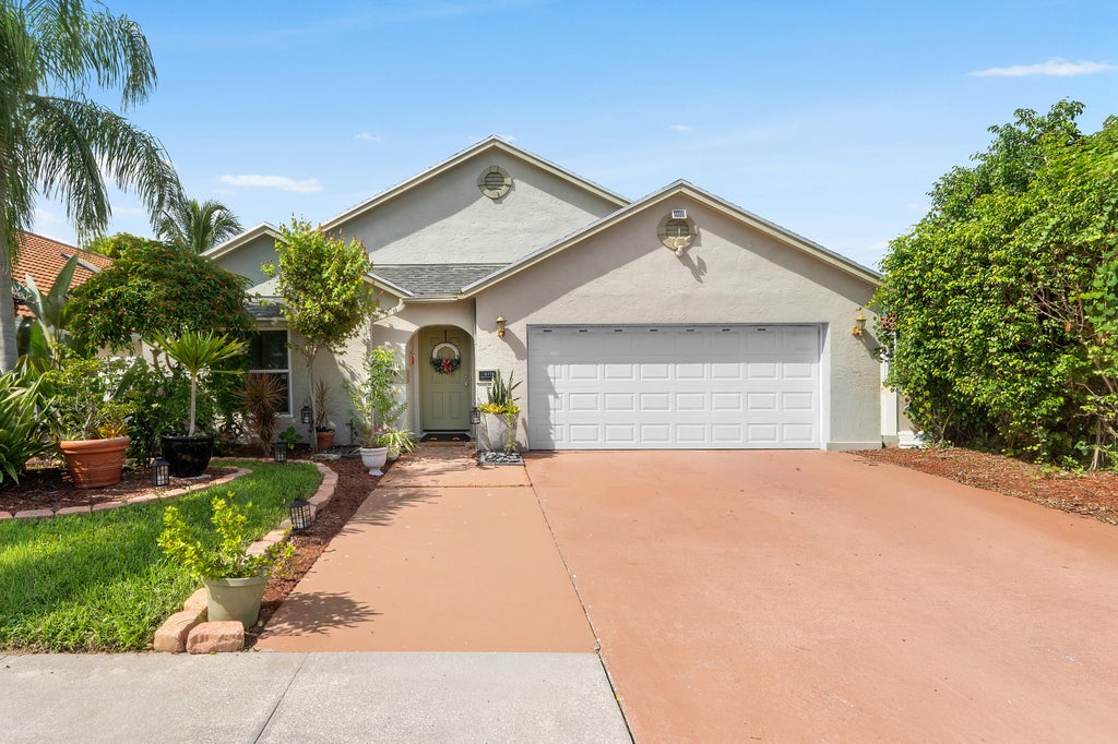 Photo of 5115 Foxhall Drive S, West Palm Beach, FL 33417 (MLS # B26070593)