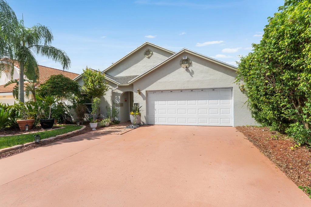 Photo of 5115 Foxhall Drive S, West Palm Beach, FL 33417 (MLS # B26070593)