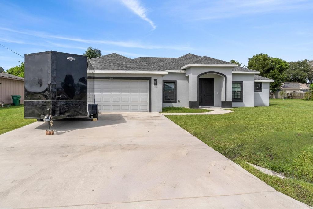 Photo of 6013 Spruce Drive E, Fort Pierce, FL 34982 (MLS # R11024962)