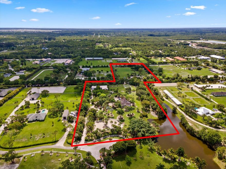 13 acre estate in the highly sought-after equestrian community of White Fences.  Surrounded by lush tropical landscaping, this property is a horse lover's dream! Located at the end of a quiet cul-de-sac, but with easy access to Hanover Circle and the showgrounds.  10 stall center aisle barn with 2 feed rooms, 2 tack rooms, wash stall and barn apartment.  The barn is completely screened in to keep bug-free. Lots of storage space for farm equipment.The regulation size dressage arena has GGT footing, mirrors, excellent drainage and irrigation. There are 5 paddocks with PVC fencing. With a total of 12.82 acres, a covered arena can easily be added to these two (currently separately deeded) lotsBesides the house with 2 Master bedroom suites, there is a 1 BR barn apartment and a 2 BR apartm