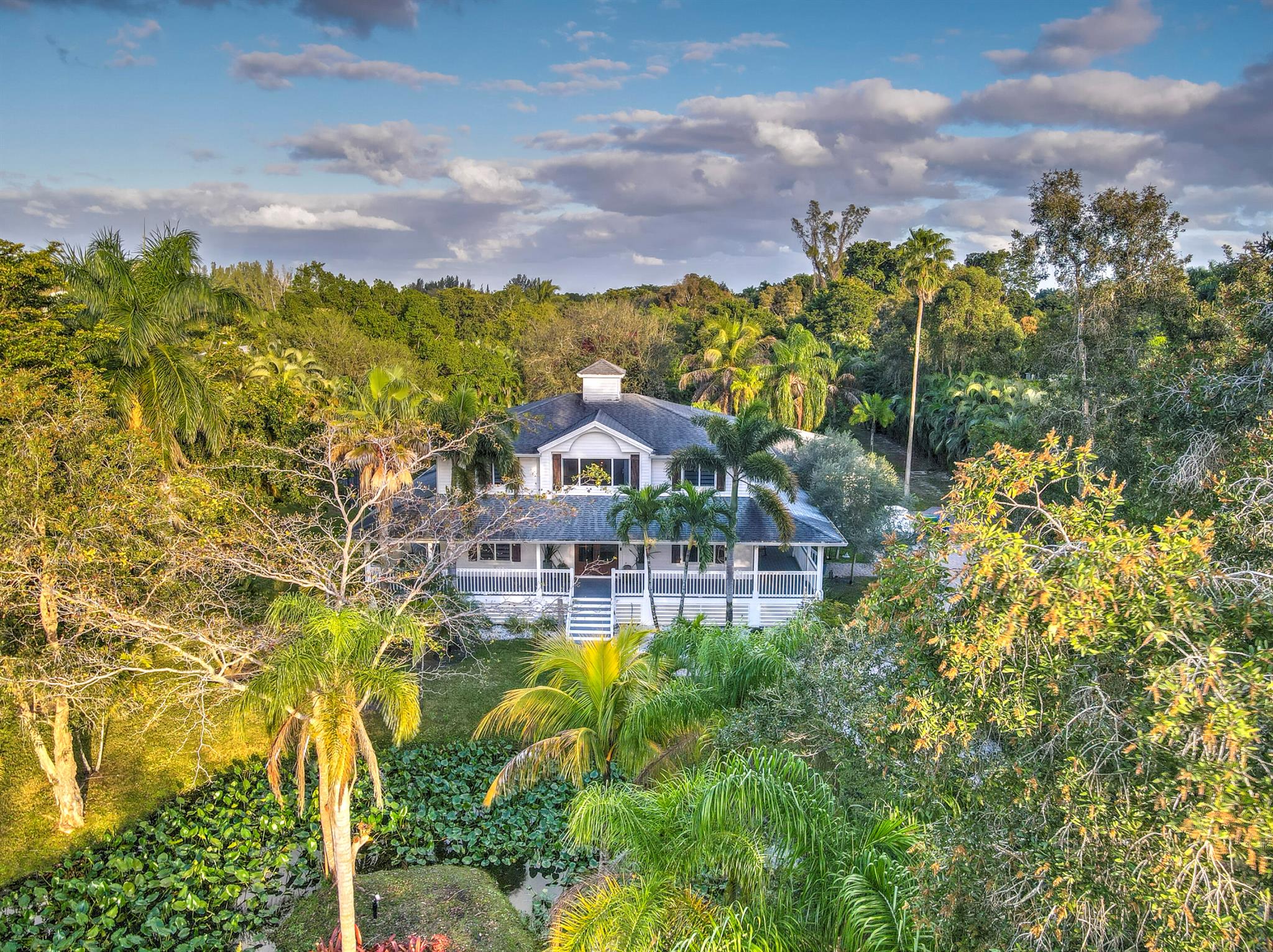 Charming Country Retreat with Modern Luxury! Escape to this breathtaking 2-acre farmhouse estate, where country charm meets modern elegance. This fully renovated 4-bed, 4-bath home features a wraparound porch, perfect for enjoying serene mornings. The state-of-the-art pool with a poolside bar and outdoor covered kitchen makes every day feel like a vacation. A private pond, horse barn, and long gated driveway create a secluded oasis, while the mother-in-law suite offers extra space for guests or extended family. The 2-car garage provides convenience, and the entire property is designed for tranquility and relaxation. Take a break from city life--ride a horse, unwind by the pool, or simply enjoy the peace. Yet, you're still close enough to everything you need. Your country retreat awaits!