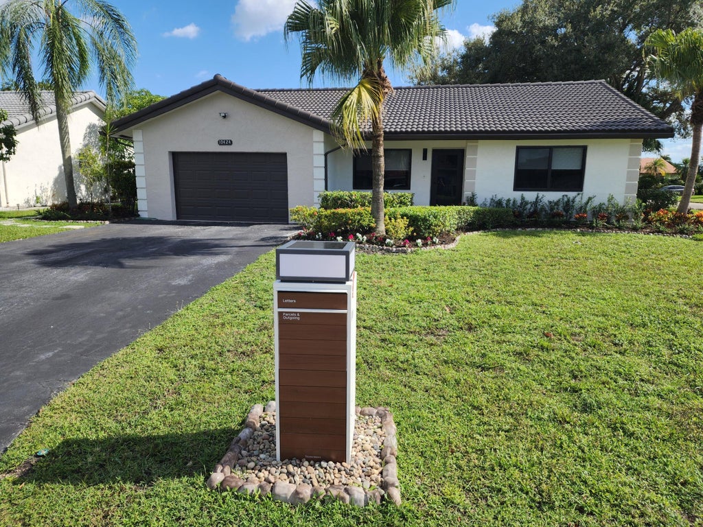 Photo of 10424 NW 70th Court, Tamarac, FL 33321 (MLS # B26091169)
