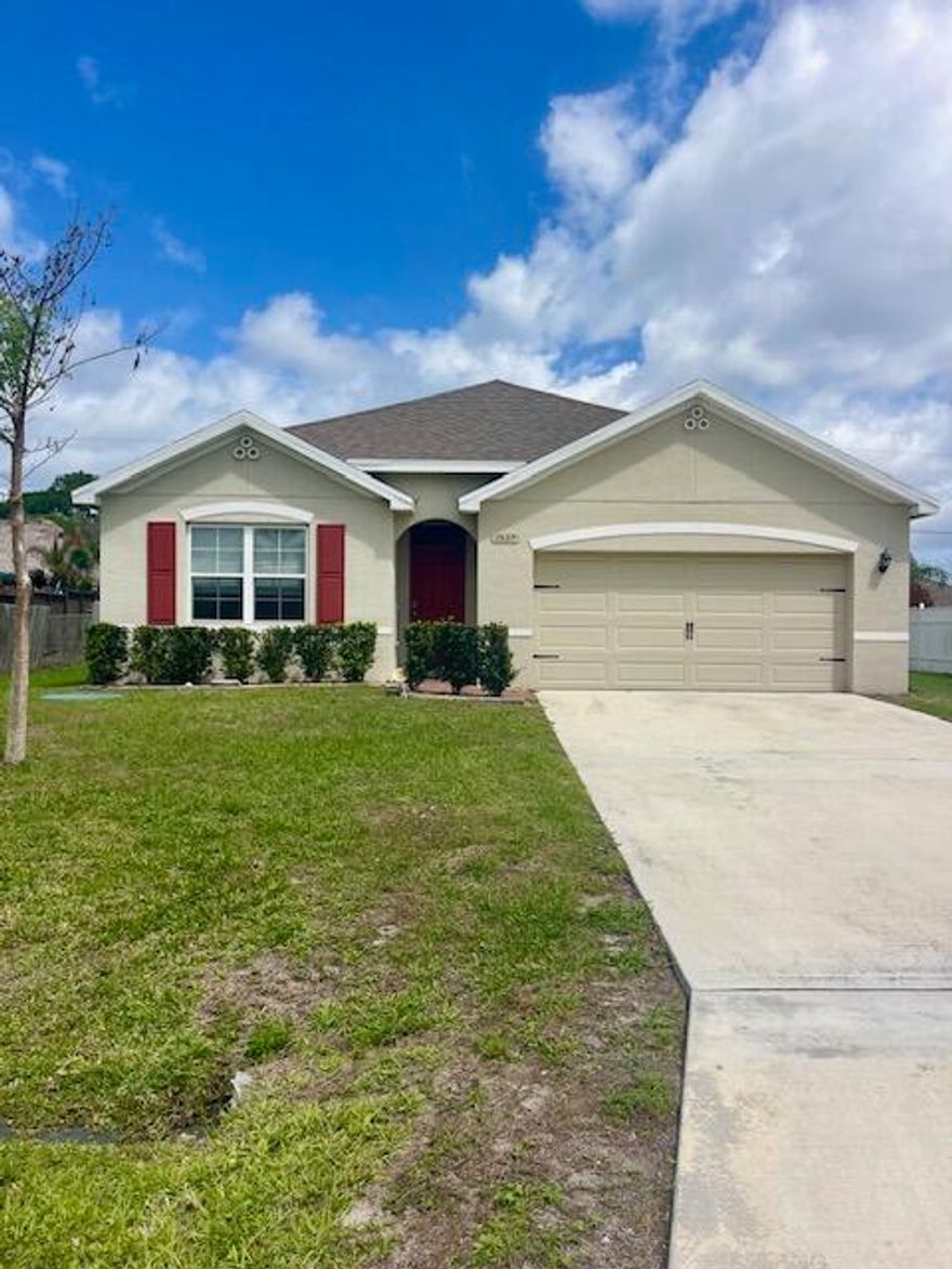 Lovely 4 bed 2 bath open floor plan home that shows like brand new in superb condition. Smart home features keyless code box door entry and alarm.  Located on a short street near Gatlin Blvd and quick access to I-95. Recent upgrades include new carpet in bedrooms, new dishwasher , Interior of home freshly painted & a/c just had major service on components. The yard is fenced on both neighbor sides and in back of home.