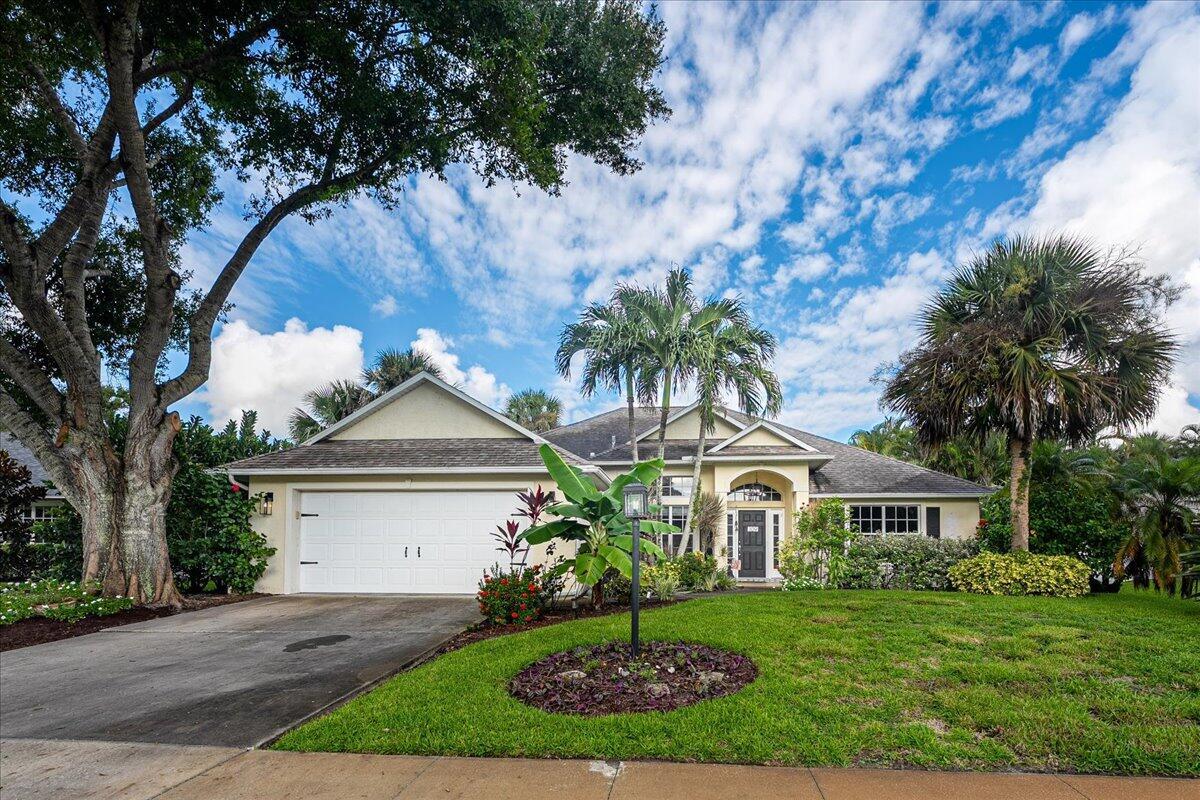 This is a must see cozy 3BR/2BA in a desirable community! Enjoy seamless indoor-outdoor living with pocketing glass sliders that open the home to a solar-heated pool and expansive screened lanai featuring a stainless steel and granite summer kitchen perfect for entertaining. You'll find volume cathedral ceilings throughout and a split-bedroom floor plan for added privacy. The kitchen is a chef's dream with two sinks, 42'' cabinetry, and stainless steel appliances. Bathrooms have been tastefully updated, and neutral tile flooring extends through all main living areas. The privacy-fenced backyard is beautifully landscaped, and the home comes equipped with storm shutters for peace of mind. Additional highlights include low HOA and a neighborhood with sidewalks and streetlights.