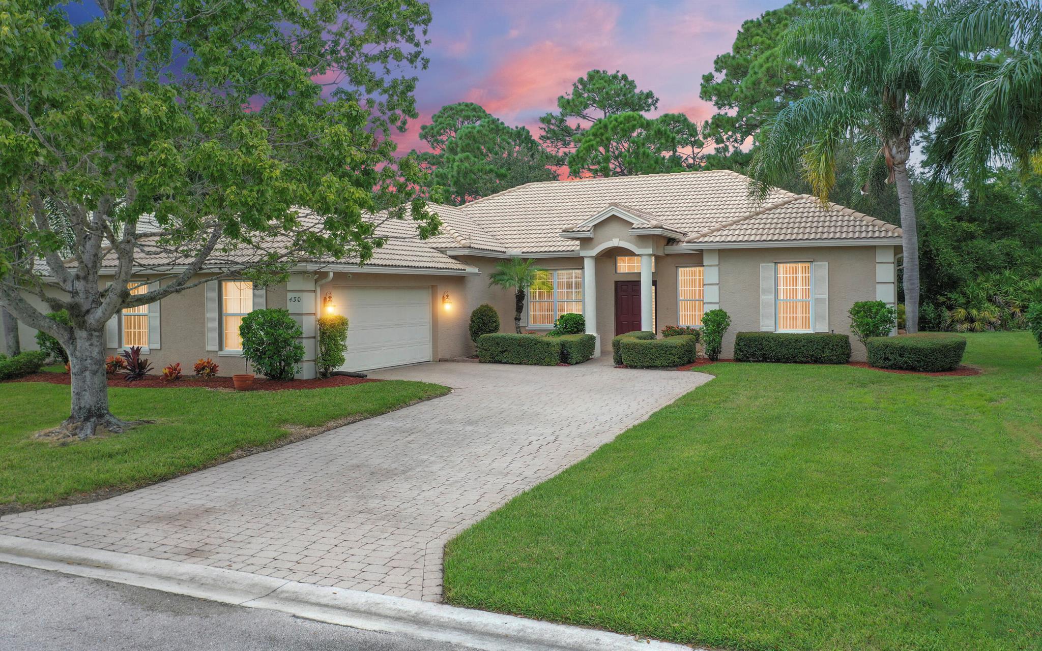 This meticulously maintained 4 bedroom home is perfect for anyone wanting endless space and a wonderful community feel. Backing up to a serene wooded backyard, exterior amenities include a barrel tile roof, gutters, inground sprinkler system, coined stucco edges, and an 8500 watt home generator. Step inside and you'll love the 10' orange peel ceilings, crown molding, and jaw dropping views from your private screened patio. The kitchen boasts gorgeous granite countertops, a matching stainless steel Whirlpool appliance package, and 16'' tile (throughout the main). All 4 bedrooms have been upgraded to luxury vinyl tile. The master bedroom offers a cozy seating area with underneath storage, perfect for book reading, as well as 2 spacious his-and-hers walk in closets. The master bedroom has a