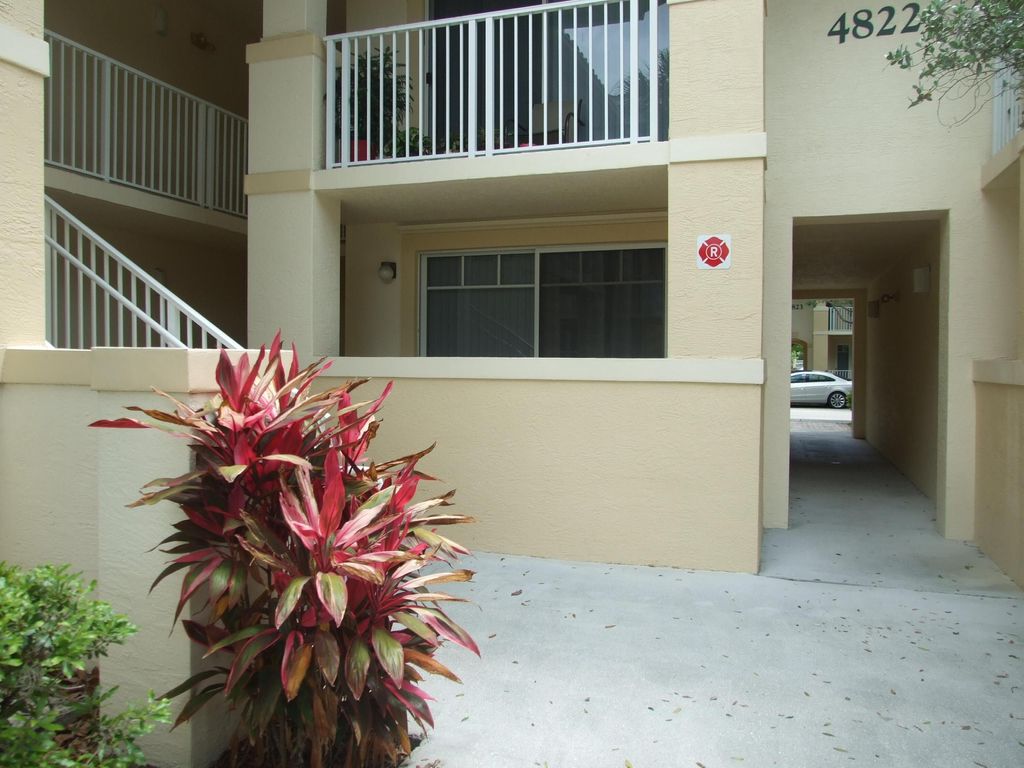 Photo of 4822 Chancellor Drive #12, Jupiter, FL 33458 (MLS # R11100594)