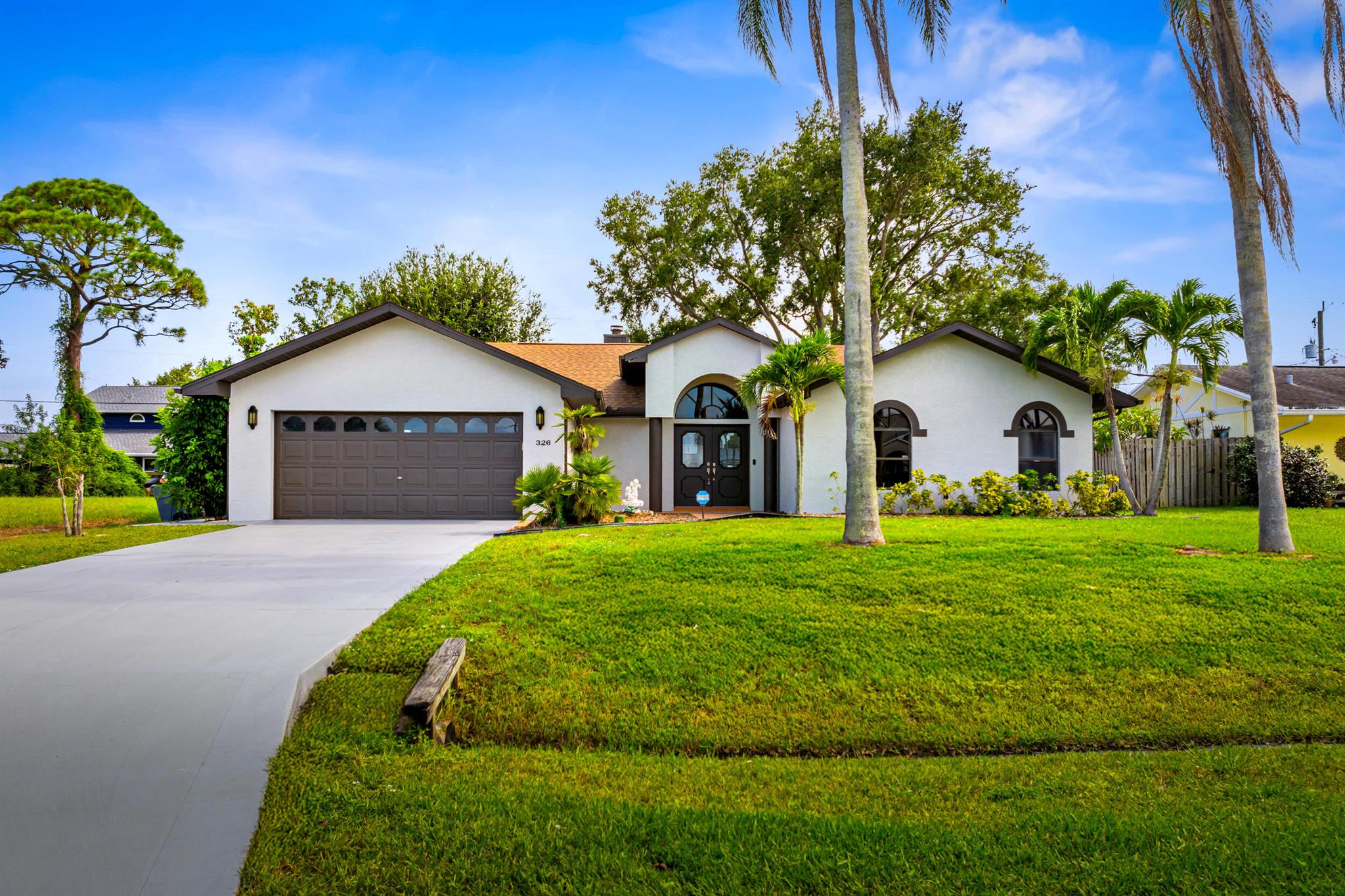 Stunning updated pool home in Port Saint Lucie! This beautifully remodeled 3BR/3BA residence offers 1972 sq ft of living space and stylish updates for the ultimate Florida lifestyle. Inside, enjoy tile floors throughout, a modern kitchen with new quartz countertops, new stainless steel appliances, and fresh interior & exterior paint. The split-bedroom layout provides privacy, while updated bathrooms and open living spaces create a bright, airy feel. Step outside to a large screen covered salt water pool with an expansive screened deck, ideal for entertaining, relaxing, or year-round enjoyment. Conveniently located near beaches, parks, golf, shopping, dining, and boat ramps. Move-in ready and waiting for you! Schedule your showing today!