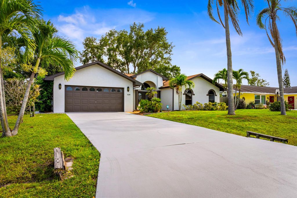 Photo of 326 NE Genesee Avenue, Port Saint Lucie, FL 34983 (MLS # R11114722)