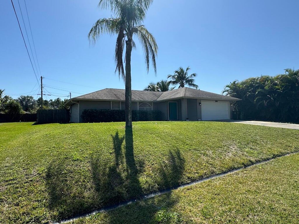 Photo of 1674 SW Whipple Avenue, Port Saint Lucie, FL 34953 (MLS # R10963725)